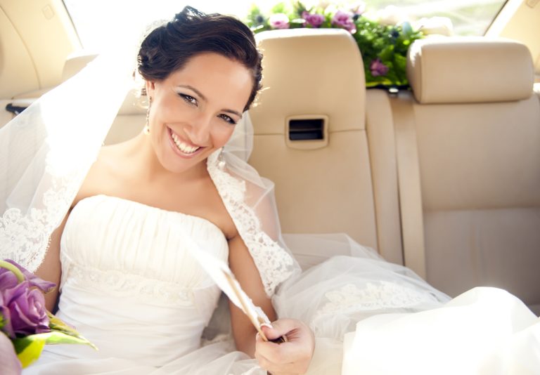 Young,Beautiful,Bride,In,The,Car