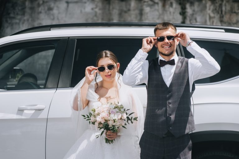 A,Stylish,Groom,In,A,Gray,Suit,And,A,Bride
